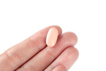 pills in woman hand