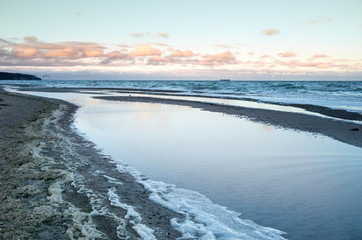beach of the baltic sea in the morning sunset