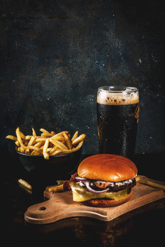 Fresh Meat And Cheese Burger With French Fries And Glass Of Dark Ginger Beer, On Dark Blue Background, Copy Space