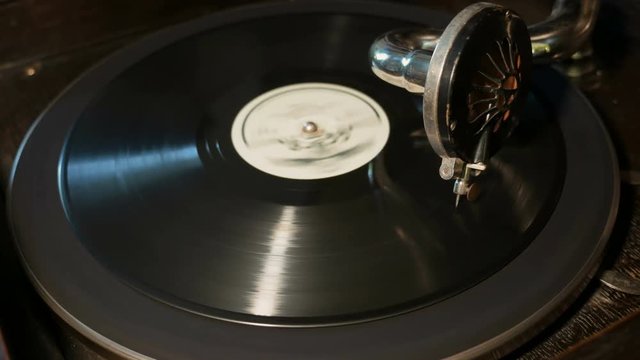 Old gramophone playing vinyl disc