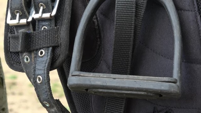 Stirrup of the saddle close-up. Detail of a horse saddle. Horseback riding.