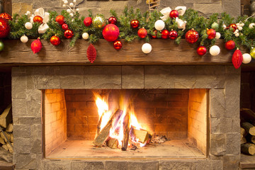 New Year / Christmas tree with colorful festive decorations on the fireplace - 185032317