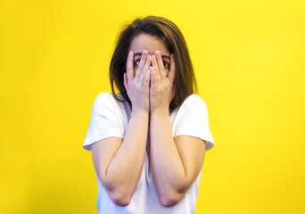 girl hands at face astonishment portrait. The concept of emotions.