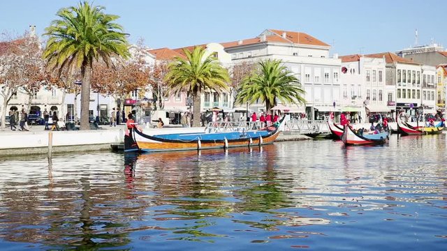 view of a canal in Aveiro city and its colorful boats (barcos moliceiros), Aveiro, Portugal - 02 December 2017