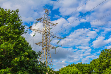power lines on blue sky background © dadamira