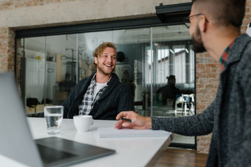 Blond man confident in his skills at a job interview