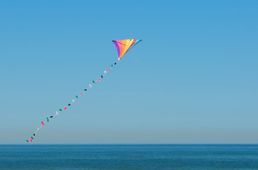 colorful kite flying in the sky - 185034512