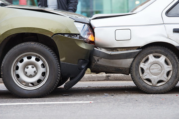 car crash accident on street, damaged automobiles after collision in city