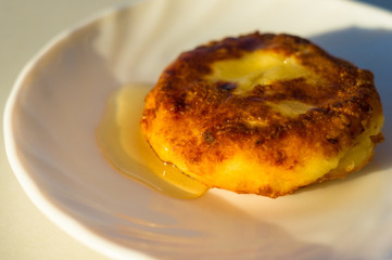 fried cheesecake drizzled with fresh honey