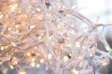Warm lights in the room. Christmas lights of a garland