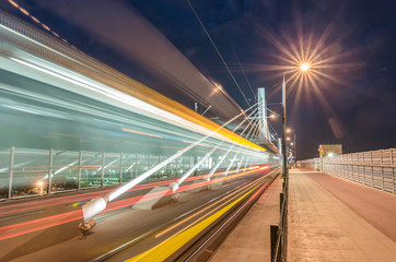 Fototapeta na wymiar tram traffic on bridge, tramway in the evening, Krakow, Poland,