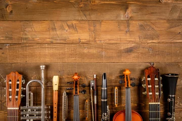 Zelfklevend Fotobehang instrument in wood background © xavier gallego morel