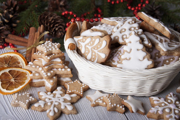Fototapeta na wymiar New Year's gingerbread decorated with icing in a white basket