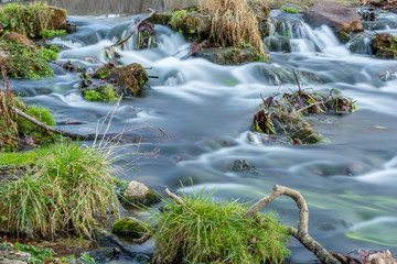 Water falling through rocks in river
