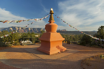 Amitabha Stupa and Prayer Flags with Distant Red Rock Landscape in Peace Park, Sedona Arizona