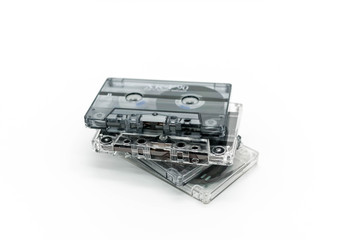 Pile of audio retro cassettes on a light background