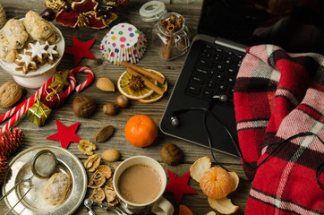 Fototapeta na wymiar Christmas and new year holiday celebration concept background. Cup of hot cocoa with homemade Christmas cookies, Xmas decoration on wooden table. Cozy Christmas at home. Christmas holidays composition
