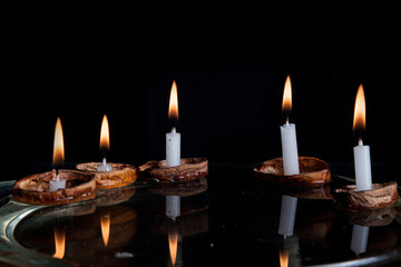 Christmas candles in walnut shell on water surface