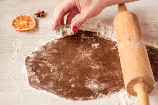 Female Hands Making Gingerbread Cookies For Christmas.