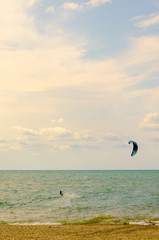 Kitesurfer enjoys active vacation on the sea