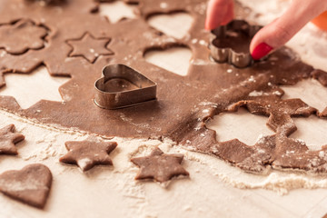 Christmas baking. Ginger dough for gingerbread on wooden table.