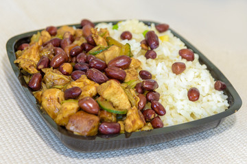 A mixture of Chinese food with rice and peanuts