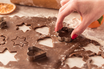 Christmas baking. Ginger dough for gingerbread on wooden table.