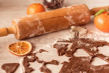 Christmas baking. Ginger dough for gingerbread on wooden table.