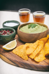 Arrangement Of Nachos (Corn Chips) And Guacamole (Avocado Sauce)