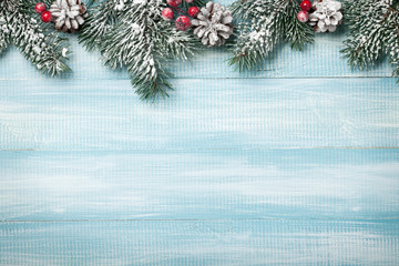 Christmas background with fir branches and cones