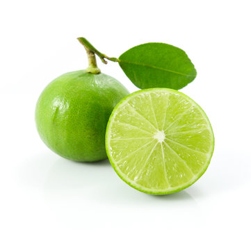Green lemons or lime with leaf isolated on white background