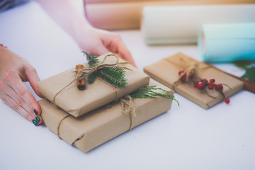 Hands of woman holding christmas gift box.