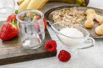 How to make layer dessert with muesli, chocolate and fruits.