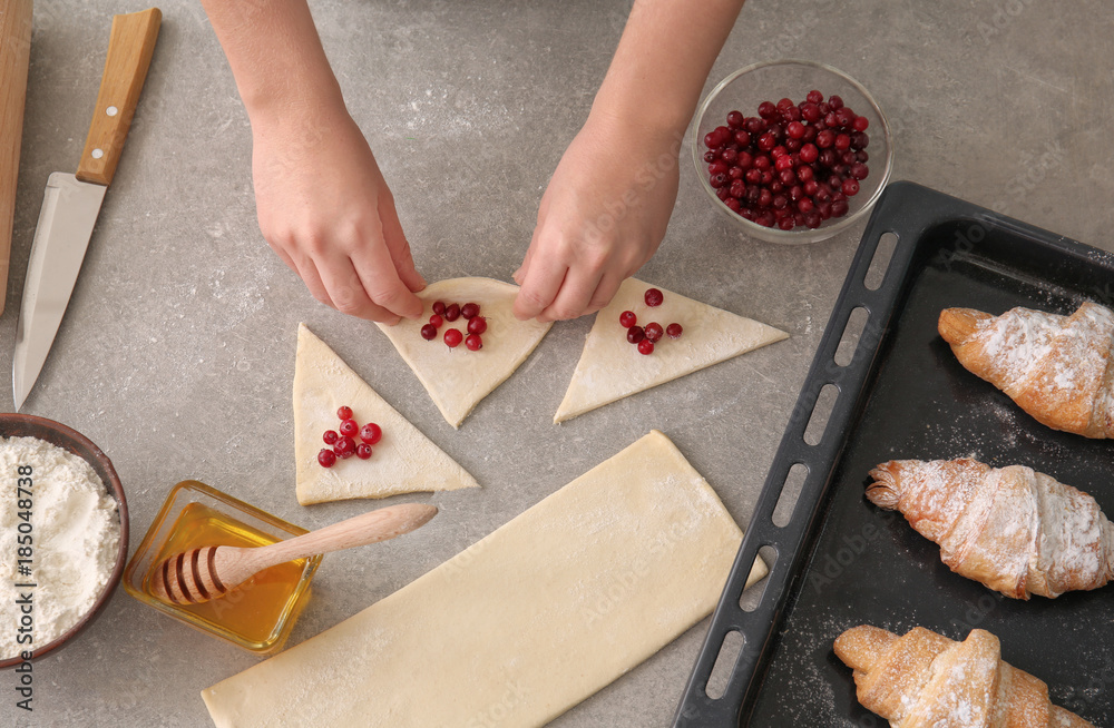 Poster woman preparing puff pastry at table