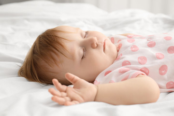 Obraz na płótnie Canvas Cute sleeping baby on bed