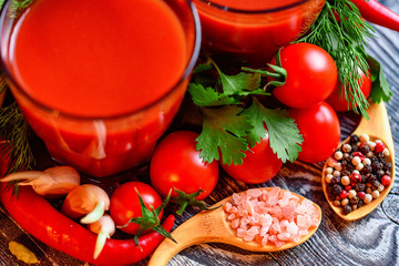 Glass of tomato juice with fresh tomatoes