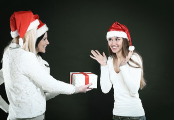 three happy young girl in costume of Santa Claus with Christmas