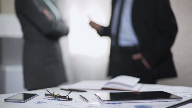 Male and female business partners discuss development project, gender equality