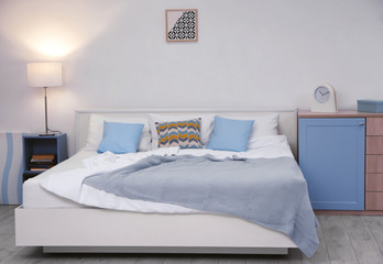 Modern bedroom interior with large bed