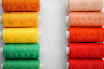 Fototapeta na wymiar Colorful sewing threads on white background