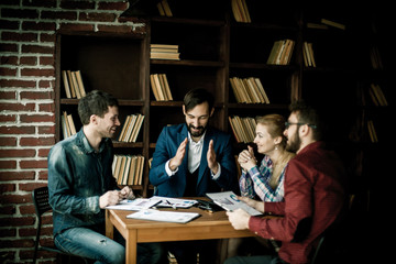 business team discussing a financial report on the company's pro