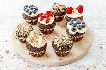 Muffins decorated with fresh fruits. Healthy snack.