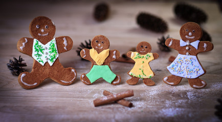 gingerbread men and cinnamon sticks on the Christmas table .