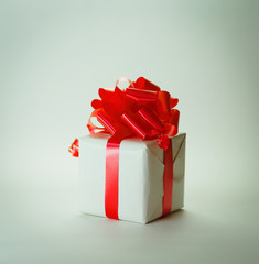 white gift box with red ribbon .isolated on white