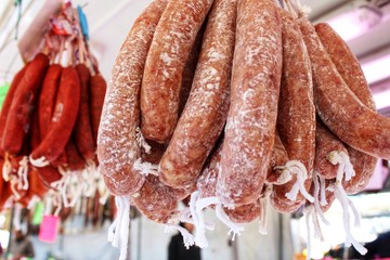 Spicy pork sausage for sale at a market stall