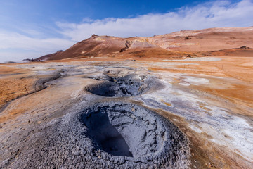Mars-like landscape – lava field with craters, boiling hot pods and smoking fumeroles in Hvellir, Iceland on a sunny day © Rene Suchan