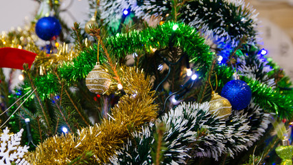 Christmas decorations on the Christmas tree. Colorful lamps and other decorations. © Rajtar photography