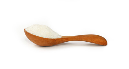 Wooden scoop spoon full of white sugar isolated