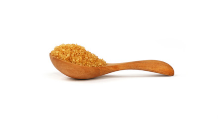Wooden scoop spoon full of brown cane sugar