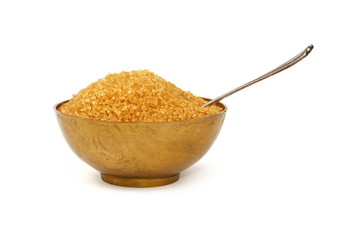 Vintage metal bowl full of brown cane sugar